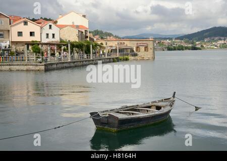 Wooden rustic boat in the ria of the fishing village of Combarro in the  province of Pontevedra in the Galicia region of Spain. Stock Photo