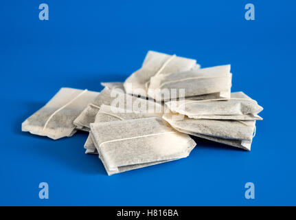 Tea in bags on blue background Stock Photo