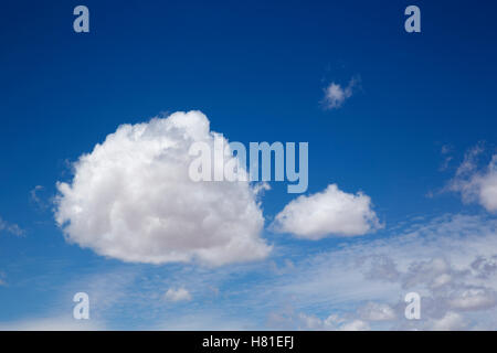 cumulus clouds against a blue sky Stock Photo