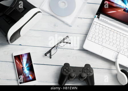 A lot of different kind of gaming accessories lying on the desk Stock Photo