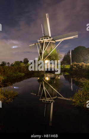De Riekermolen is a historic polder drainage windmill from 1636 on the bank of the River Amstel in Amsterdam. Stock Photo