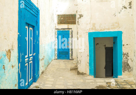 The bright blue color traditionally is used for windows and doors in old arabic towns of Tunisia, Sousse. Stock Photo