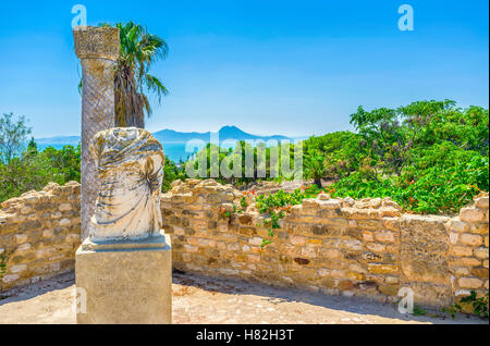 The pleasant walk among the Roman ruins on the picturesque hill of Carthage, Tunisia. Stock Photo