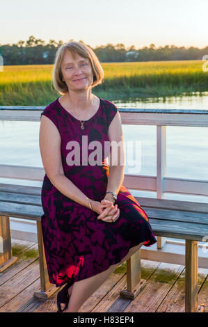 Portrait of middle-aged woman at sunset; inland bay near Charleston; South Carolina; USA Stock Photo