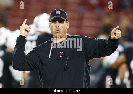 September 18, 2010; Stanford, CA, USA; Stanford Cardinal head coach Jim Harbaugh instructs his team during warm ups before the game against the Wake Forest Demon Deacons at Stanford Stadium. Stock Photo