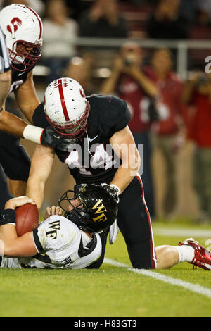 September 18, 2010; Stanford, CA, USA; Stanford Cardinal linebacker Chase Thomas (left) sacks Wake Forest Demon Deacons quarterback Tanner Price (11) during the second quarter at Stanford Stadium. Stock Photo