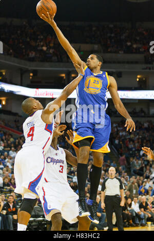 October 29, 2010; Oakland, CA, USA;  Golden State Warriors small forward Rodney Carney (25) is fouled by Los Angeles Clippers guard Randy Foye (4) while shooting during the fourth quarter at Oracle Arena. The Warriors defeated the Clippers 109-91. Stock Photo