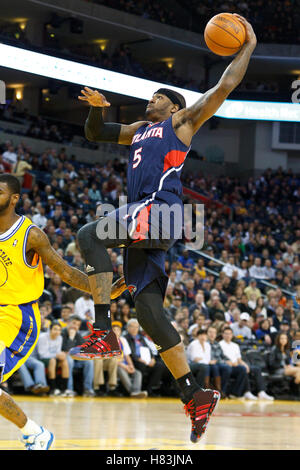 February 25, 2011; Oakland, CA, USA;  Atlanta Hawks power forward Josh Smith (5) jumps for a dunk against the Golden State Warriors during the first quarter at Oracle Arena. Stock Photo