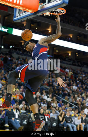 February 25, 2011; Oakland, CA, USA;  Atlanta Hawks power forward Josh Smith (5) dunks against the Golden State Warriors during the first quarter at Oracle Arena. Stock Photo