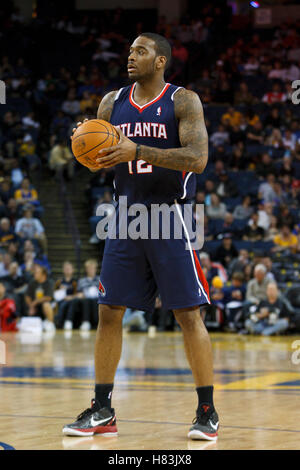 February 25, 2011; Oakland, CA, USA;  Atlanta Hawks center Josh Powell (12) holds the ball against the Golden State Warriors during the fourth quarter at Oracle Arena. Atlanta defeated Golden State 95-79. Stock Photo