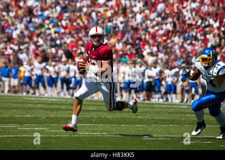 September 3, 2011; Stanford, CA, USA;  Stanford Cardinal quarterback Andrew Luck (12) rushes for a touchdown against the San Jose State Spartans during the first quarter at Stanford Stadium. Stock Photo