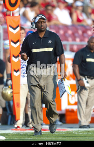 Colorado head coach Jon Embree talks with referees during the first ...