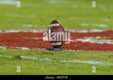 Nov 19, 2011; Stanford CA, USA;  Detailed view of a football on a kicking tee on the field before the game between the Stanford Cardinal and the California Golden Bears at Stanford Stadium.  Stanford defeated California 31-28. Stock Photo