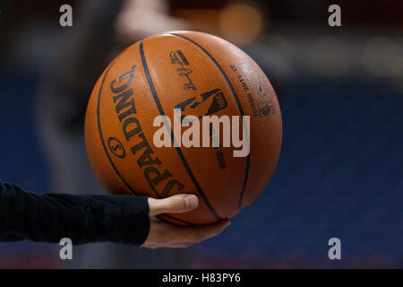 Jan 8, 2012; Sacramento, CA, USA; Detailed view of an NBA baskeball in the hand of an unidentified ball boy before the game between the Sacramento Kings and the Orlando Magic at Power Balance Pavilion. Stock Photo