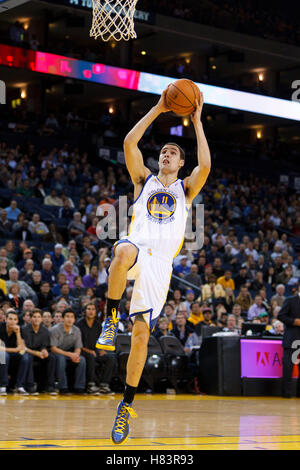Jan 25, 2012; Oakland, CA, USA; Golden State Warriors guard Klay Thompson (11) shoots against the Portland Trail Blazers during the second quarter at Oracle Arena. Golden State defeated Portland 101-93. Stock Photo