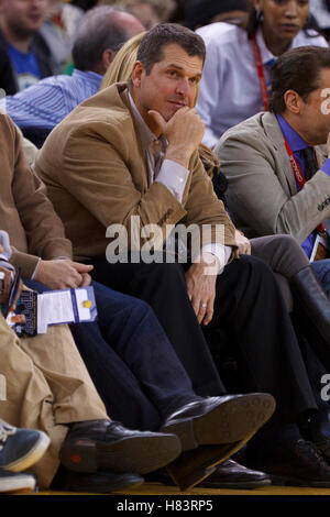 Feb 15, 2012; Oakland, CA, USA; San Francisco 49ers head coach Jim Harbaugh sits in the stands during the third quarter between the Golden State Warriors and the Portland Trail Blazers at Oracle Arena. Portland defeated Golden State 93-91. Stock Photo