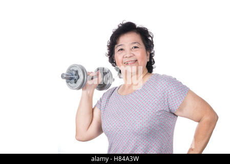 Asian strong senior woman lifting weights, isolated on white background. Stock Photo