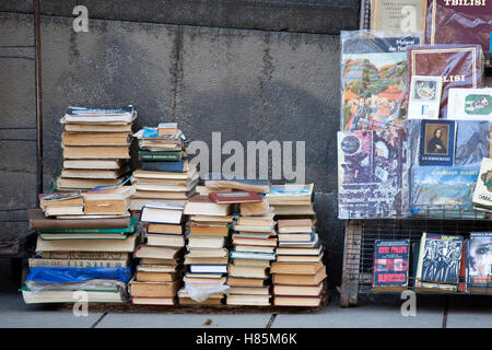 TBILISI, GEORGIA - November 04, 2016: Street seller sell second hand books on various subjects Stock Photo