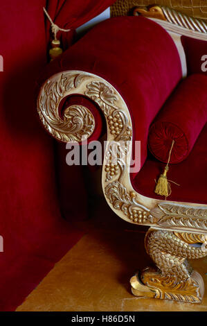 Red velvet textile sofa in the interior room studio Stock Photo