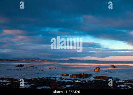 The Pentland Hills and Arthur’s Seat from Longniddry Bents at dawn, East Lothian Stock Photo