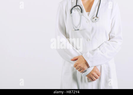 Female doctor posing confident in white medical uniform, general practitioner with stethoscope in hospital clinic office Stock Photo