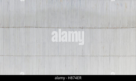 Industrial building wall made of corrugated metal sheet, flat background photo texture Stock Photo