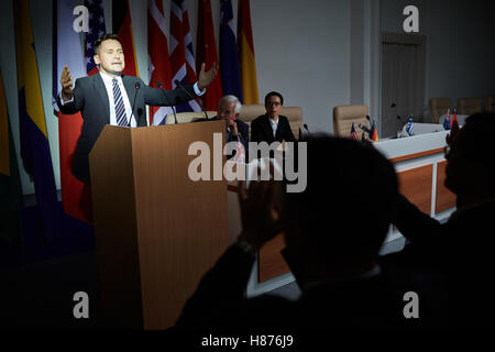 Man giving speech at summit Stock Photo