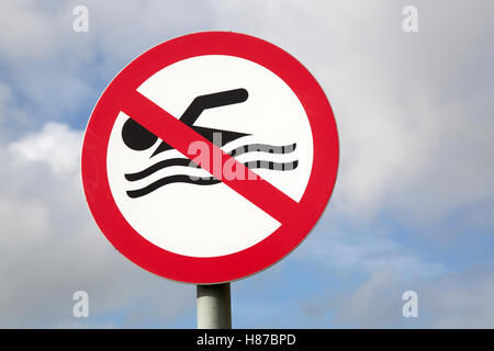 Swimming Ban Sign against Blue Sky Stock Photo