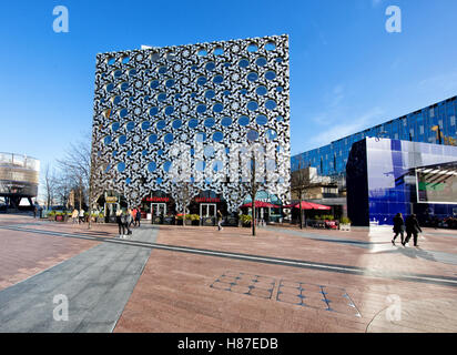 Mirrored facade of Ravensbourne College on the Greenwich Peninsula close to the O2 Dome in London UK Stock Photo