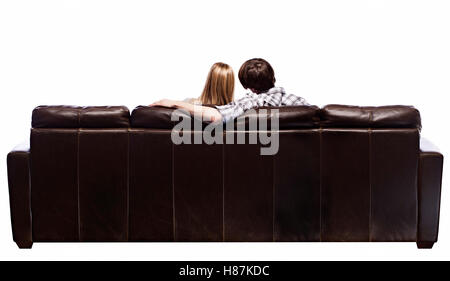 Young couple on Leather Sofa Stock Photo