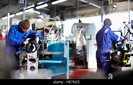 Two young Engineers working on metal Lathes. Northern Powerhouse Stock Photo