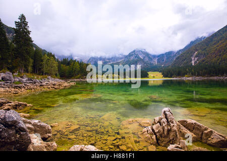 Autumn scenery at lake Fusine ( Lago di Fusine) mountain lake in north Italy in the Alps. Stock Photo