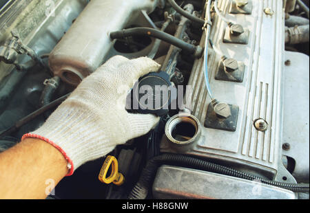 The cover oil filler neck of the car in a hand Stock Photo