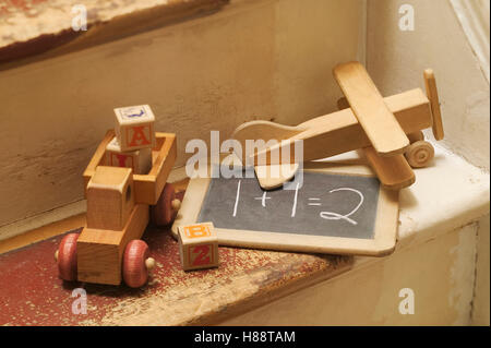 old wooden toys on stairs Stock Photo