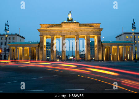 Traces of light at the Brandenburg Gate at night, Berlin Stock Photo