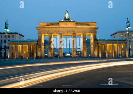 Traces of light at the Brandenburg Gate at night, Berlin Stock Photo