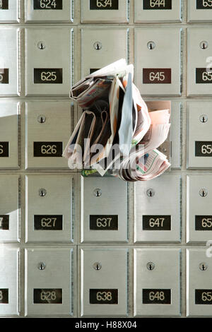 Close-up of mailbox slot and junk mail Stock Photo - Alamy