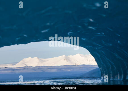 View from ice cave over the Fjallsárlón Glacier Lagoon, glacial lake in winter, Iceland Stock Photo