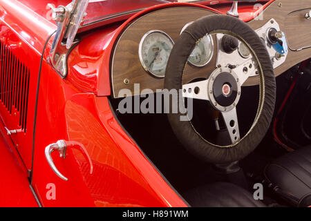 Dashboard of red 1953 MG TD Midget Stock Photo