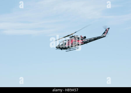 Maribor, Slovenia - April 16, 2016: Red Bull helicopters as part of display team The Flying Bulls performing aerobatics Stock Photo