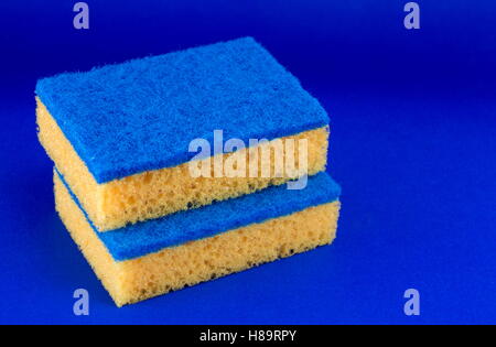 https://l450v.alamy.com/450v/h89rpy/two-sponges-for-washing-dishes-on-blue-background-h89rpy.jpg