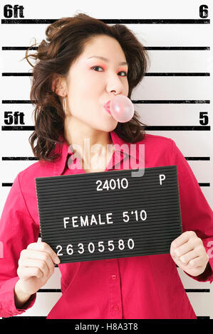 Mugshot of female criminal Stock Photo - Alamy