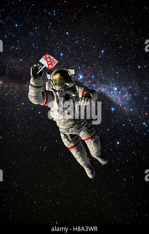 astronaut  in space holding for sale sign Stock Photo