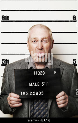 senior man in police lineup Stock Photo