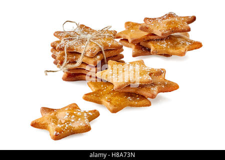 Variously stacked ginger cookies  with powdered sugar on white Stock Photo