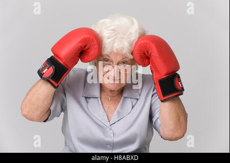 Senior woman wih boxing gloves Stock Photo