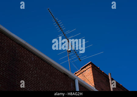 old non HD analog Television antenna on rooftop Stock Photo