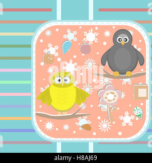 textile owl and a penguin on a tree in winter Stock Photo