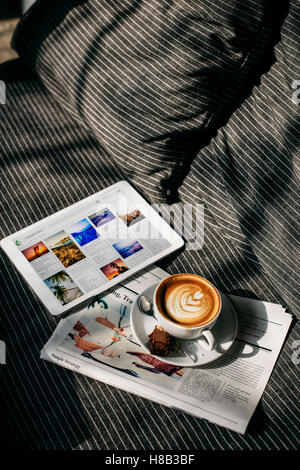 Coffee Americano Espresso Newspaper Couch Brownie Digital Tablet Concept Stock Photo