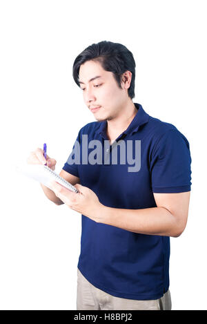 Asian businessman holding pen and writing notebook or diary for checking, isolated on white background. Stock Photo